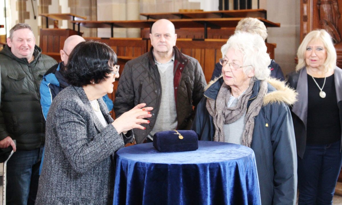 Antiques expert Anita Manning conducting a valuation at Blackburn Cathedral